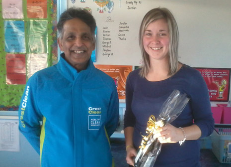 Pictured is Invercargill Franchisee Siva Krishnan with Room 5 Teacher Nicole McMath who received a bottle of wine for her part in having the cleanest classroom in the School.