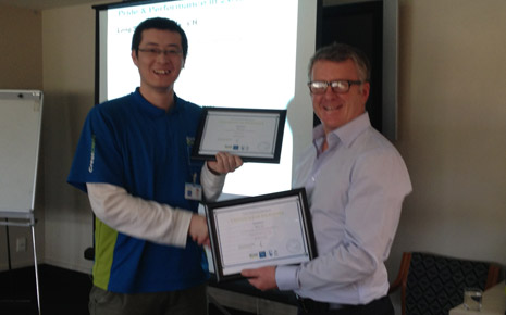 Grant McLauchlan congratulates Leo Li on achieving two ‘Certificates of Excellence’ awards