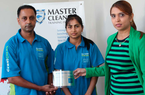 South Auckland Regional Director Nilesha Narayan presents South Auckland Franchisees Mahesh & Dipti Kanji with their 10 Year Service Award.