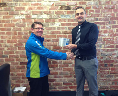 Vincent Fisk receiving his 10 Year Long Service Award from Otago Regional Director Tony Kramers. 