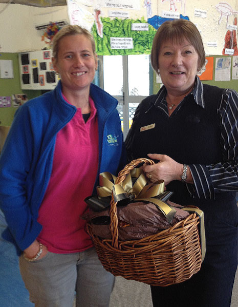 Melissa Palmer and Jackie Matthews accepting a gift basket of goodies, presented to CrestClean’s 3000th customer, ABC Blenheim Central Daycare.