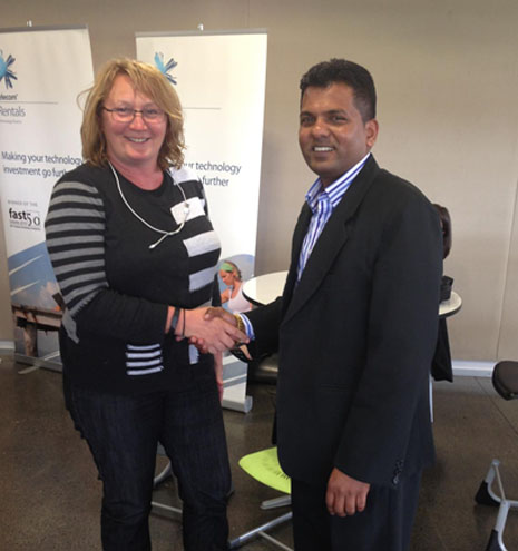CrestClean's Viky Narayan congratulates Susannah Fowler, principal of The Gardens School and winner of the draw for a new TV.