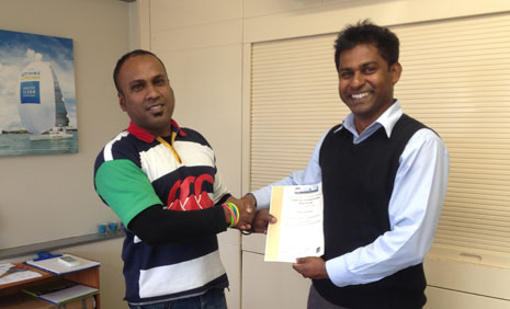 Ronesh Nand accepting his Cleaning Professional Skills Suite Certificate from Regional Director Yasa Panagoda.
