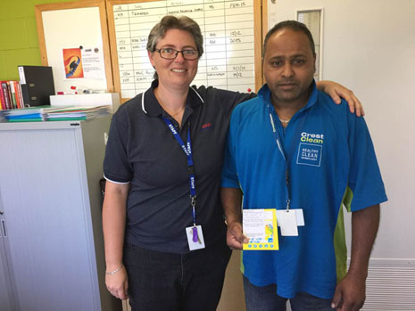 Wiri Oil HSSE Assurance Manager Natalee Scripps with CrestClean franchisee Dinesh Prasad and his award for excellent service.