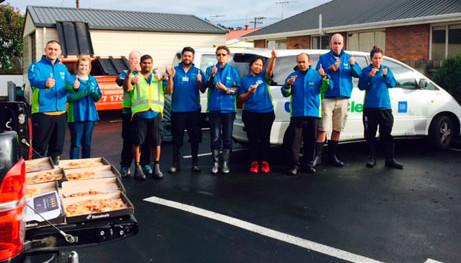 CrestClean Dunedin franchisees enjoyed pizza after they finished cleaning up the kitchen at Radius Fulton Resthome, which was evacuated as a result of flooding.