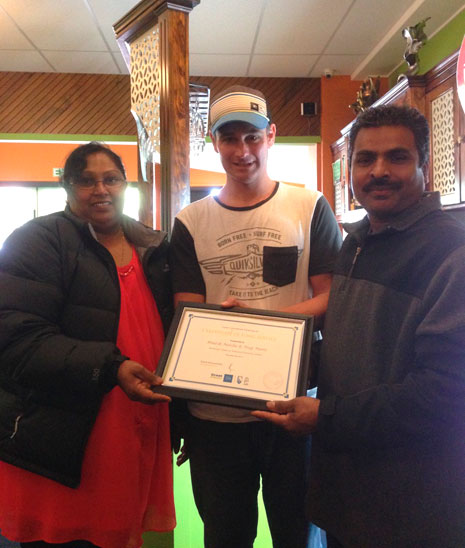 Franchisees Nag Mani and Binesh Naidu were presented with their three-year long service award by Tauranga Regional Manager Jan Lichtwark.