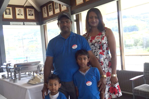 Dan and Madhu are pictured with their two sons Ryan and Tyler.