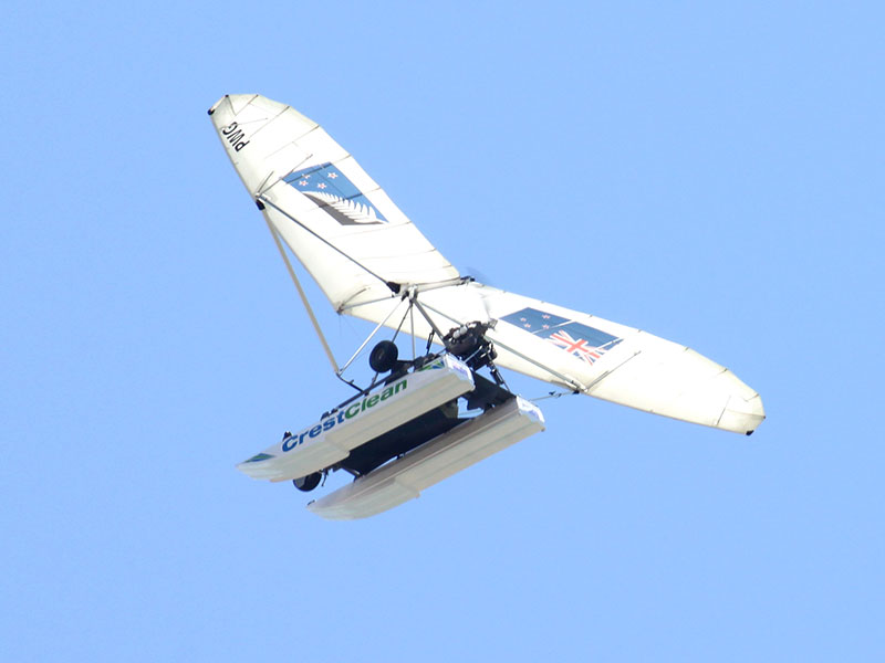 The CrestClean sponsored Amphibious Microlight displays New Zealand’s two flag options – the current New Zealand flag and the contender flag.