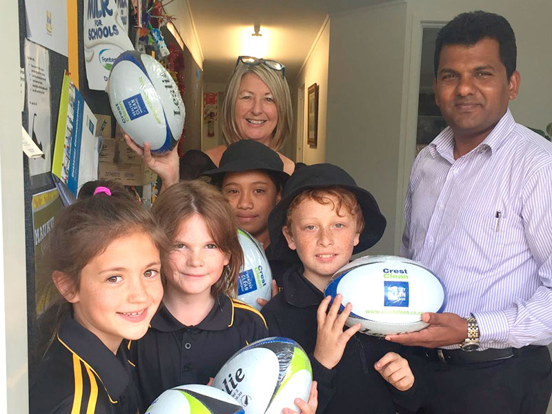 Auckland South Regional Manager Viky Narayan donated five rugby balls to Mauku School for their annual Fun Run fundraising event. Viky is pictured with principal Angela Smith.