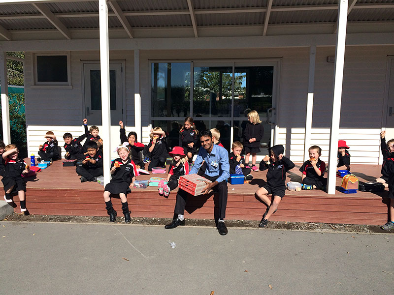 Pizza definitely put smiles on Room 3 pupils at Methven School who won the CrestClean Cleanest Classroom competition. They are pictured with franchisee Mayank Patel.