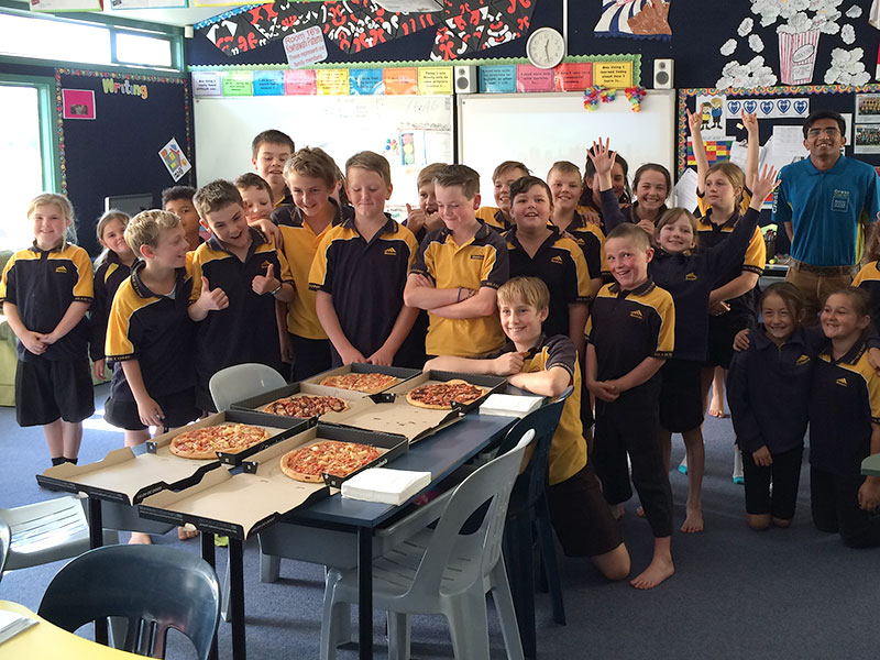 Bluestone School’s Room 16 enjoyed a pizza lunch for winning the Cleanest Classroom competition. Pupils are pictured with franchisee Harsh Patel.