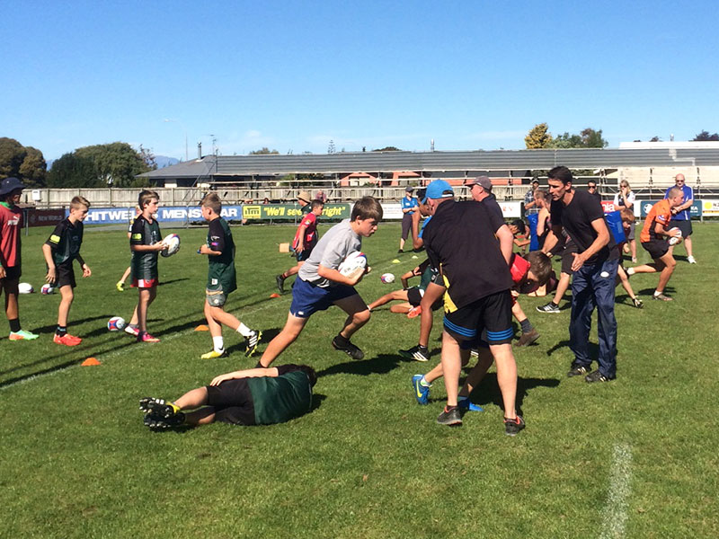 Junior rugby players enjoyed practicing skills and drills with John Leslie.