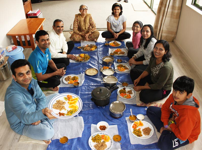 CrestClean franchisee Pinakin Patel (left) enjoying a family meal. Pinakin is sharing some of his family’s favourite recipes.