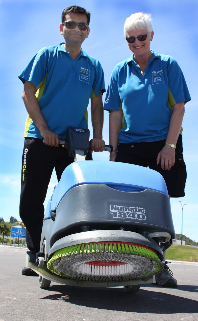 Pinakin Patel and Jill Shepherd check out a battery-powered floor scrubber.