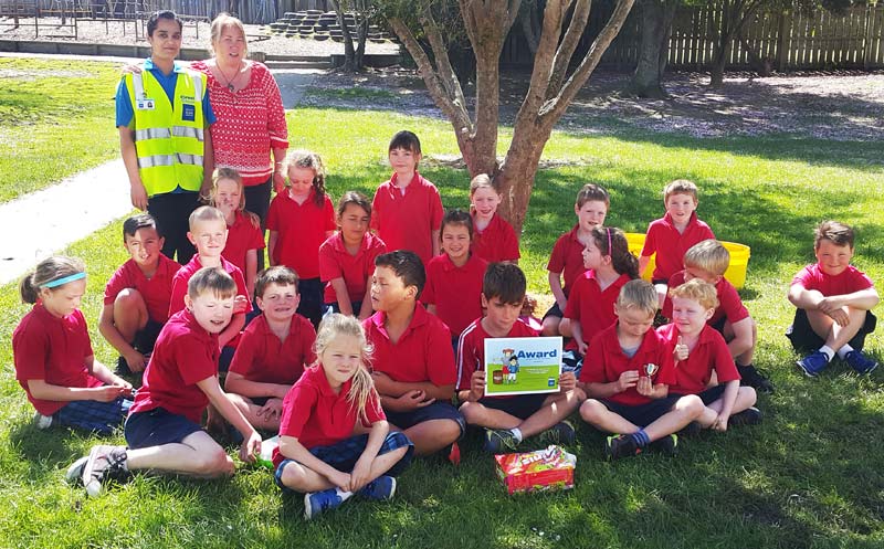 Crest franchisee Farina Shah hands out the Cleanest Classroom Award at Rosebank School in Balclutha. With her are Room 10 teacher Pam Farley and the junior pupils.