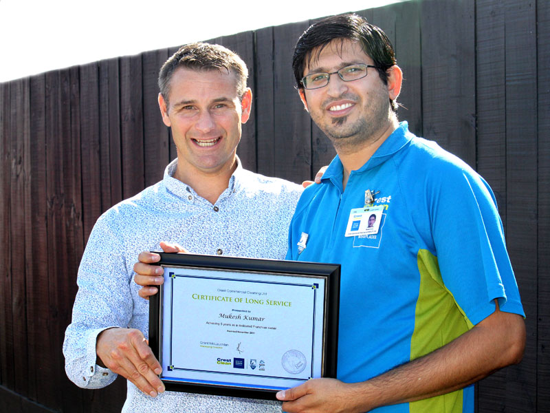 Mukesh Kumar receives his Certificate of Long Service from Jan Lichtwark, CrestClean’s Tauranga Regional Manager. 