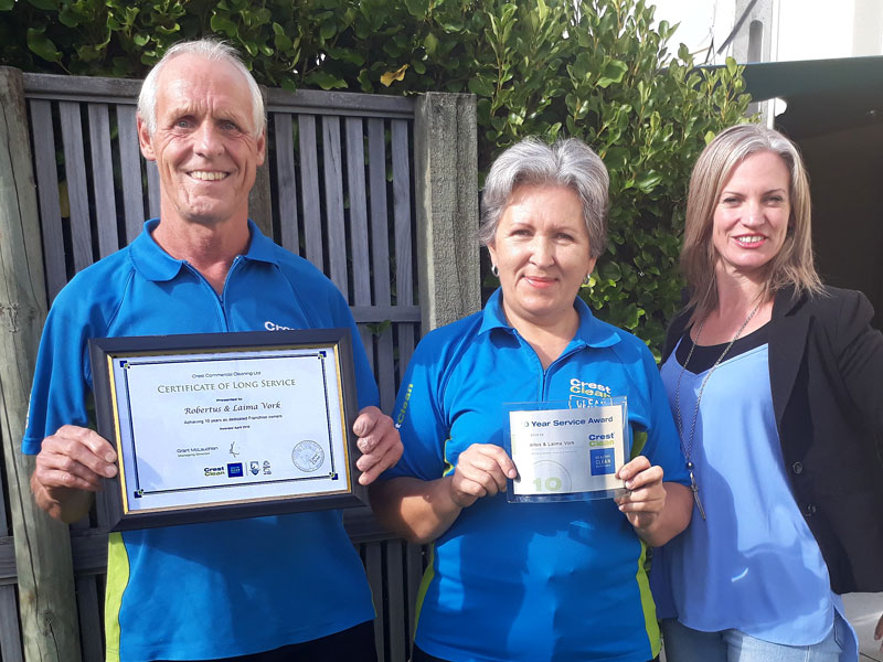 Robertus and Laima Vork receive their Certificate of Long Service from Abby Latu.
