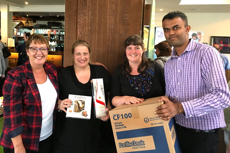 Lucky draw winners Kelly Gasdon and Helen Auty with CrestClean’s Neil Kumar and Caroline Wedding. 