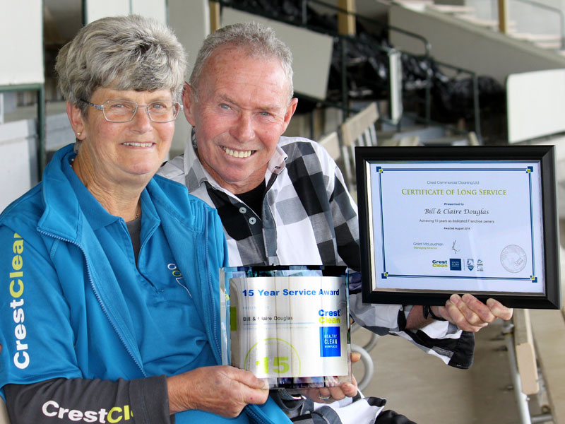 Claire and Bill Douglas with their 15 Year Service Award. The couple were the first CrestClean franchisees in Rotorua when they started their business in 2003.