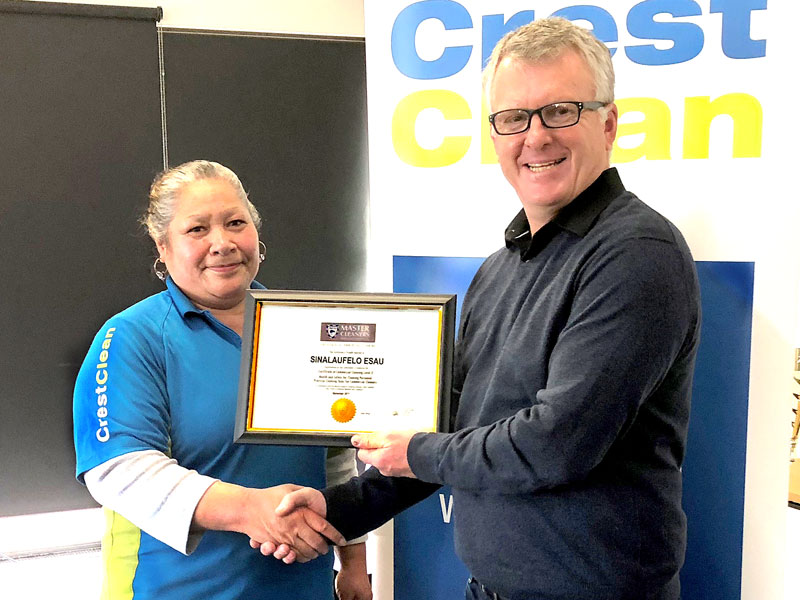 Sina Esau receives a Certificate in Commercial Cleaning Level 2 from Grant McLauchlan, Crest’s Managing Director. 